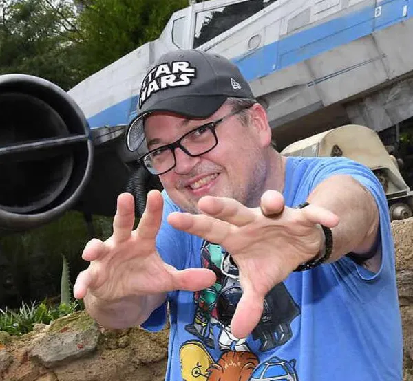 Thomas Florimonte, Jr. reaching toward the camera in a Star Wars cap